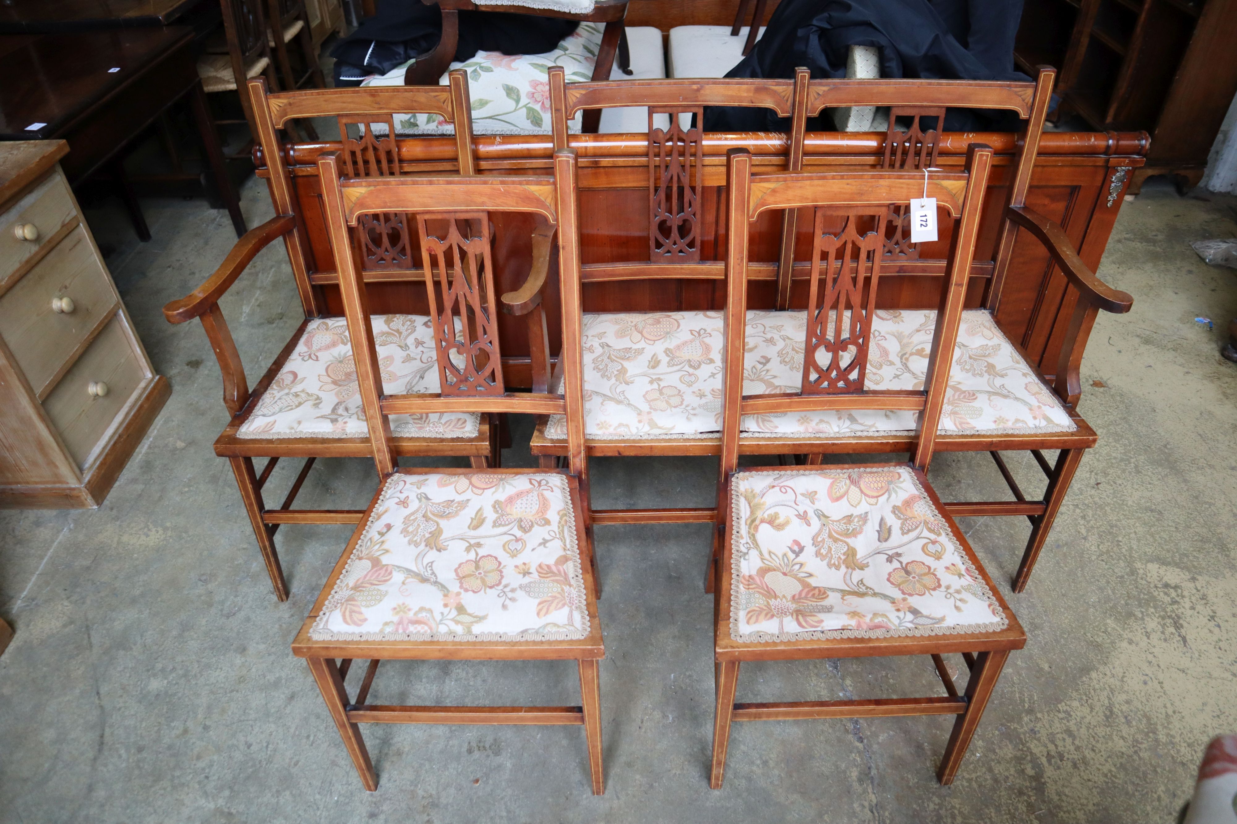 An Edwardian inlaid mahogany four piece part salon suite